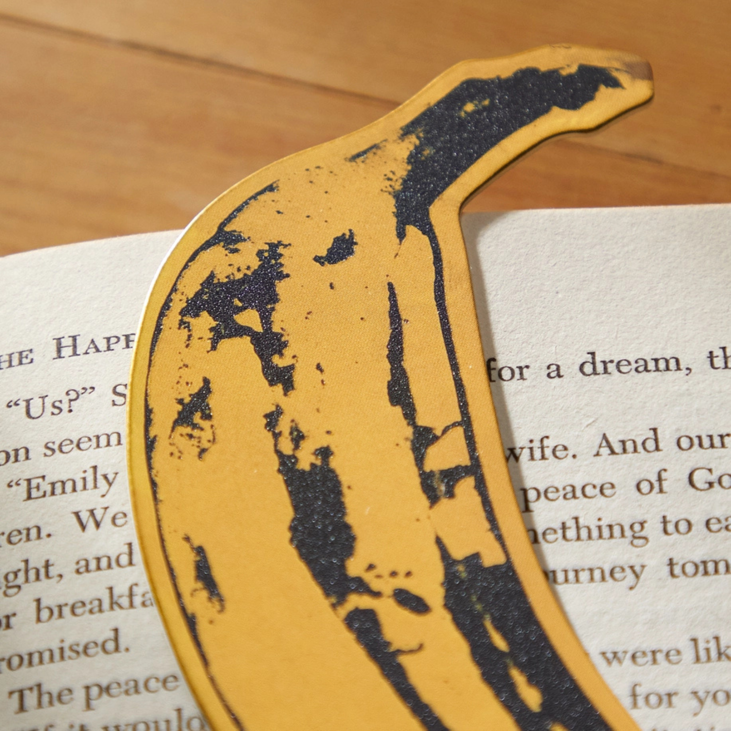 Yellow banana-shaped object on a book with text