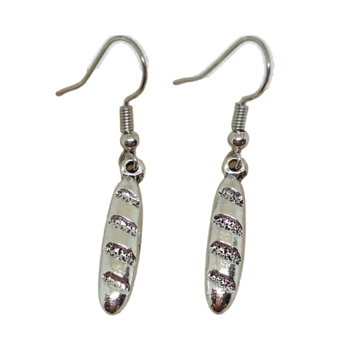 Pair of silver French baguette bread loaf earrings with textured design on a white background