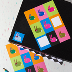 Colorful checkered sticker sheet with cartoon rabbit designs on a white background
