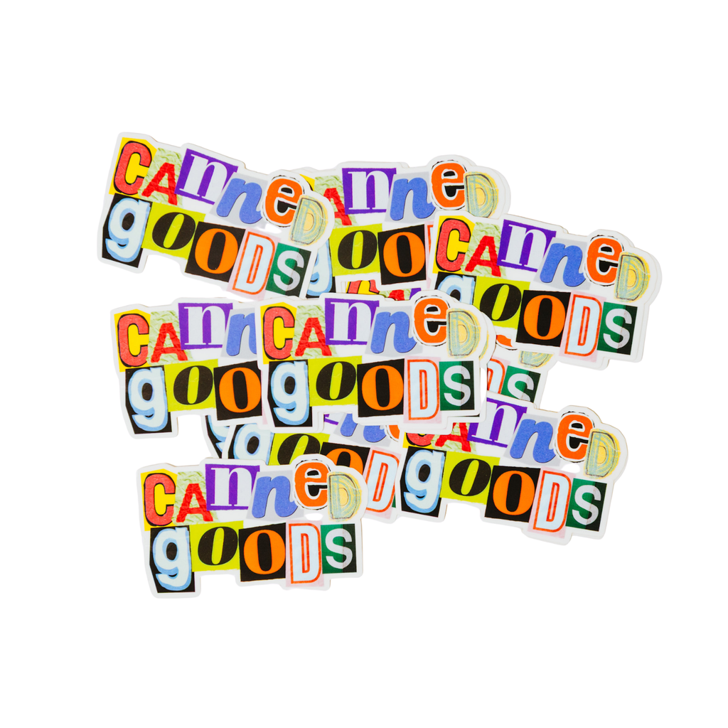 Colorful cut-out letters spelling 'Canned Goods' on a white background