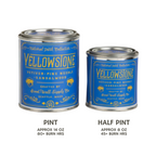 Two cans of Yellowstone scented candles, one pint and one half pint, on a white background.