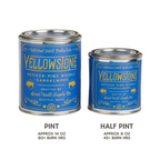 Two cans of Yellowstone scented candles, one pint and one half pint, on a white background.
