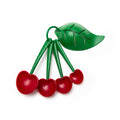 Cherry-shaped measuring spoon set with green leaf holder and built-in egg separator by OTOTO for baking and cooking.