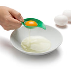 Cherry leaf egg separator separating egg yolk from egg white in a mixing bowl, part of the OTOTO cherry measuring spoon set.