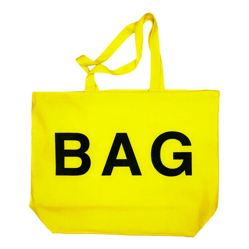 Yellow tote bag with 'BAG' printed on it against a white background