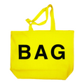 Yellow tote bag with 'BAG' printed on it against a white background
