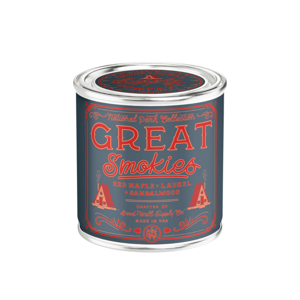 Candle with a label of Great Smokies paint with red and white text on a blue background