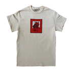 Beige t-shirt with a graphic of a devil and 'HELL' text on a white background