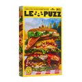 LE PUZZ Puzzle packaging with a colorful illustration of a layered sandwich on a yellow background
