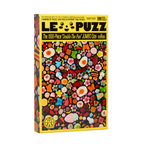 A 1000-piece jigsaw puzzle box titled 'LE PUZZ' featuring a vibrant, multicolored candy-themed illustration on the front, set against a plain white background.