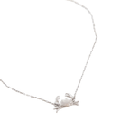 A silver chain bracelet featuring a small, brushed textured Maryland Blue Crab pendant, shown against a plain white background.