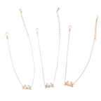 Three delicate chain bracelets with small Maryland blue crab pendants in gold, silver, and rose gold finishes, displayed against a plain white background.
