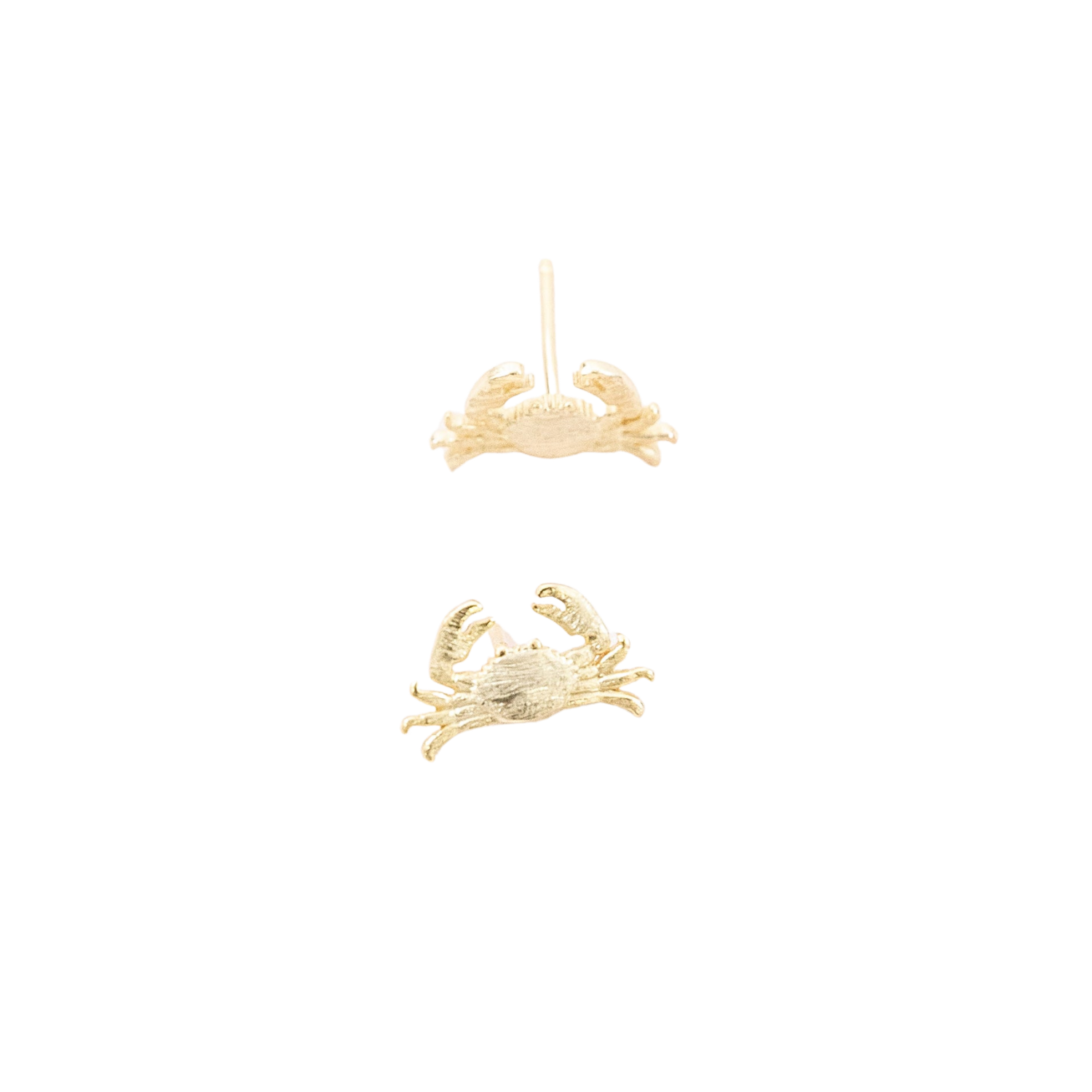 A pair of gold crab stud earrings shown against a plain white background, with one earring positioned above the other.