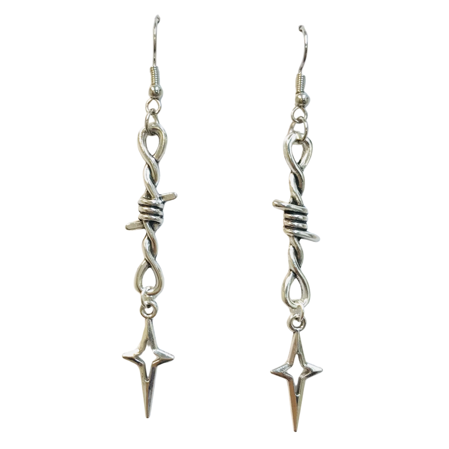 Pair of silver earrings with barbed wire and star-shaped ends on a white background