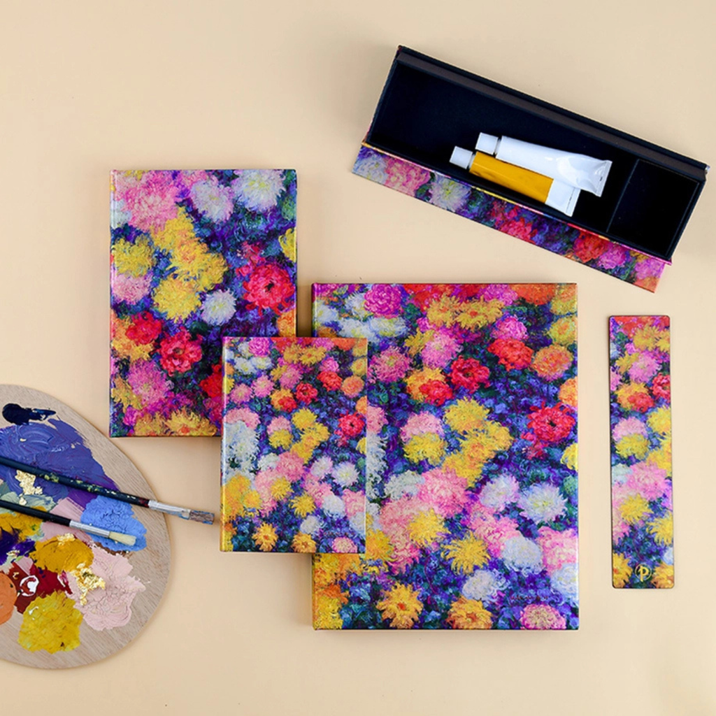 Colorful floral-patterned art supplies on a beige background