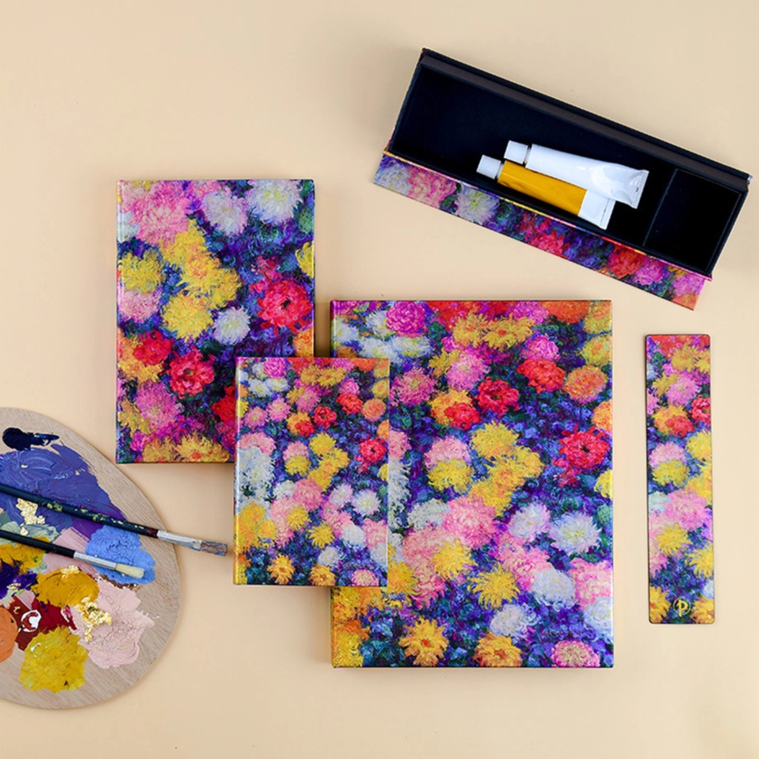 Colorful floral-patterned art supplies on a beige background