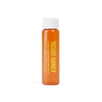 Small bottle of Nuclear Fallout Radioactive honey with a white cap on a white background