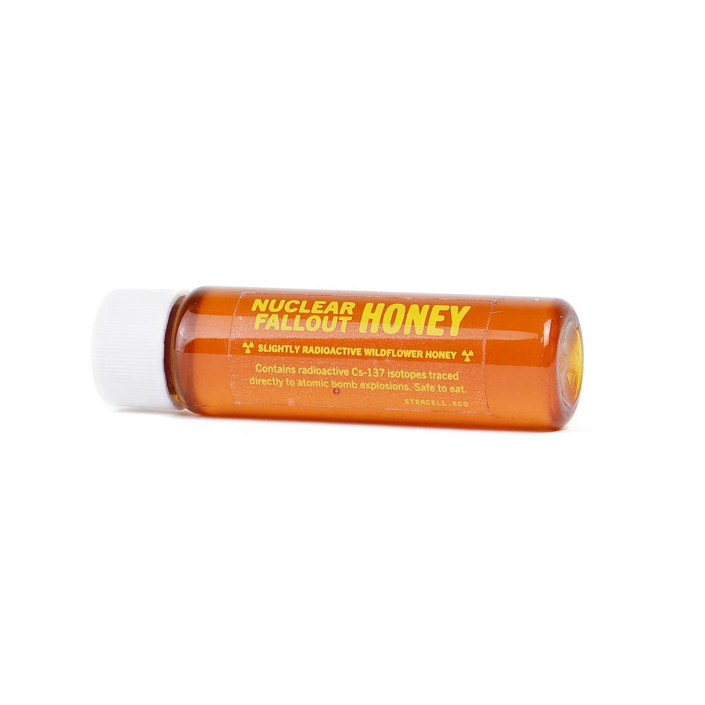 Small bottle of Nuclear Fallout Wildflower Honey on a white background