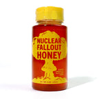 Bottle of 'Nuclear Fallout Honey' with a yellow cap on a white background