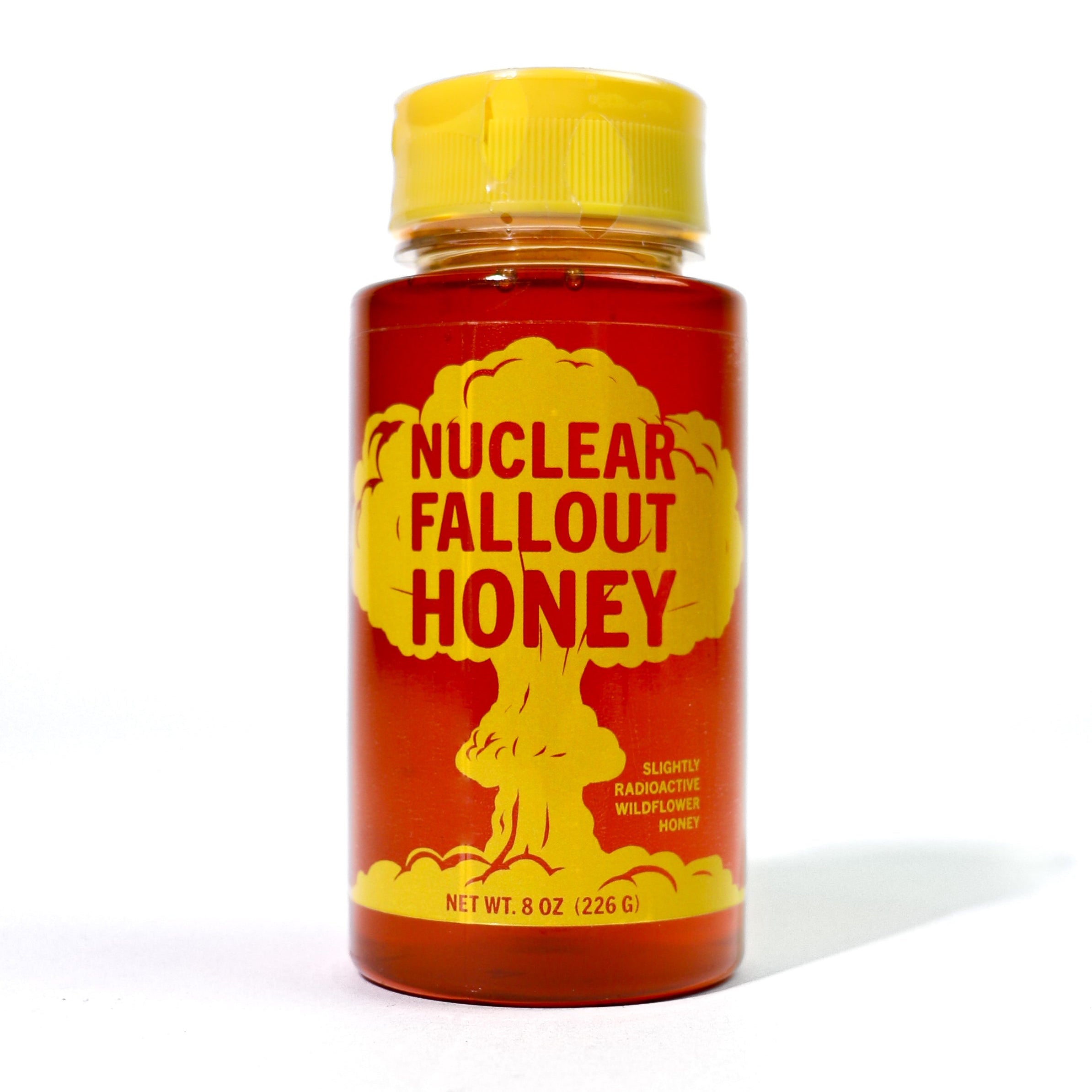 Bottle of 'Nuclear Fallout Honey' with a yellow cap on a white background