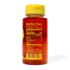 Bottle of honey with nutrition facts label on a white background