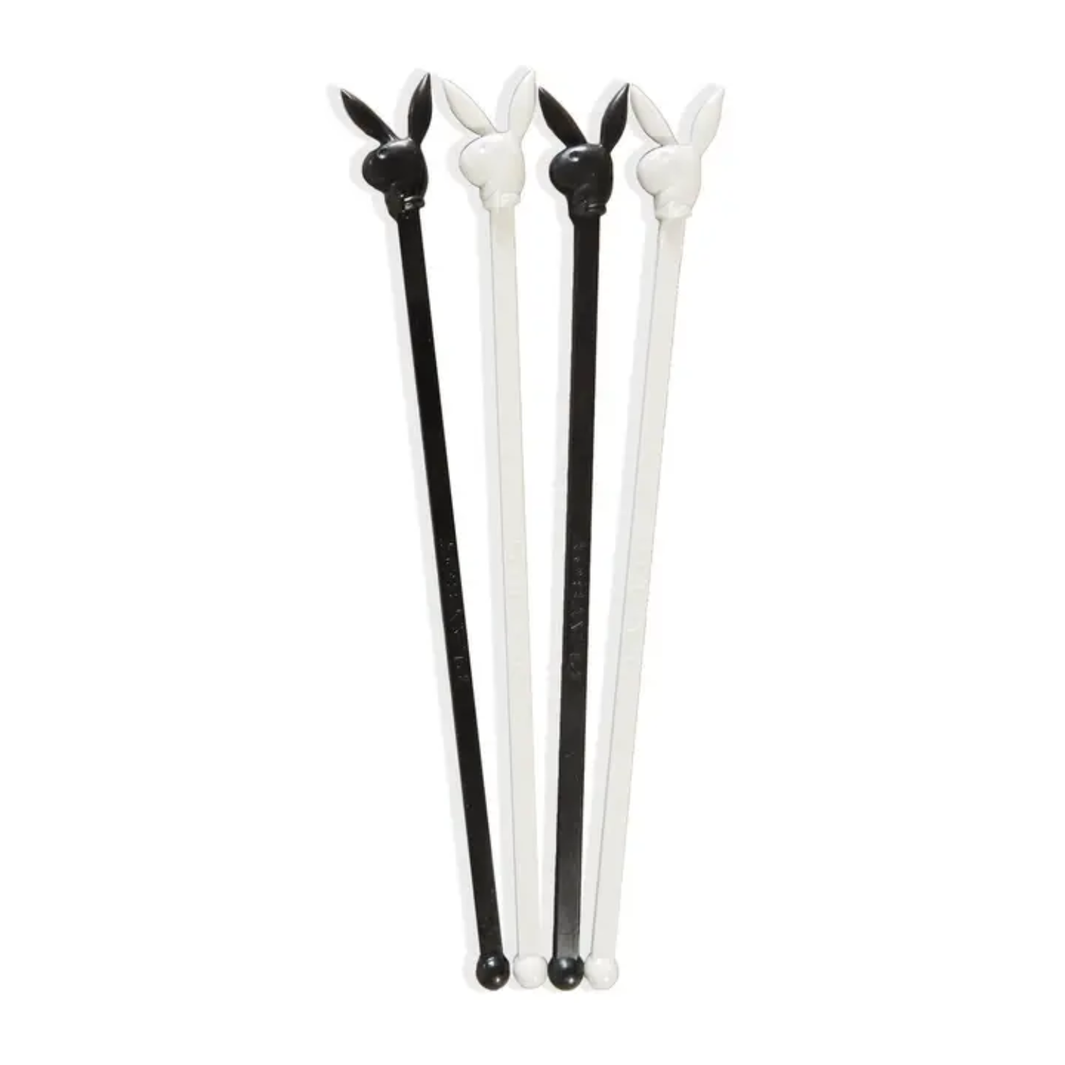 Set of four black and white Playboy Bunny-shaped stir sticks on a white background