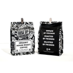 Front and back view of coffee bag from 'Rise Up' on a white background