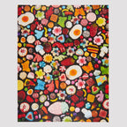 Colorful pattern of various gummy candies on a black background