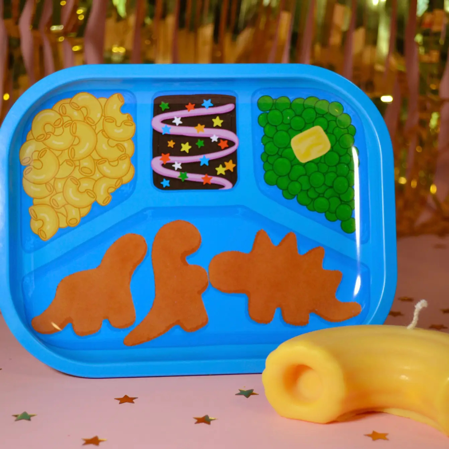 Blue tray with Kids Cuisine design on a pink surface with star decorations.