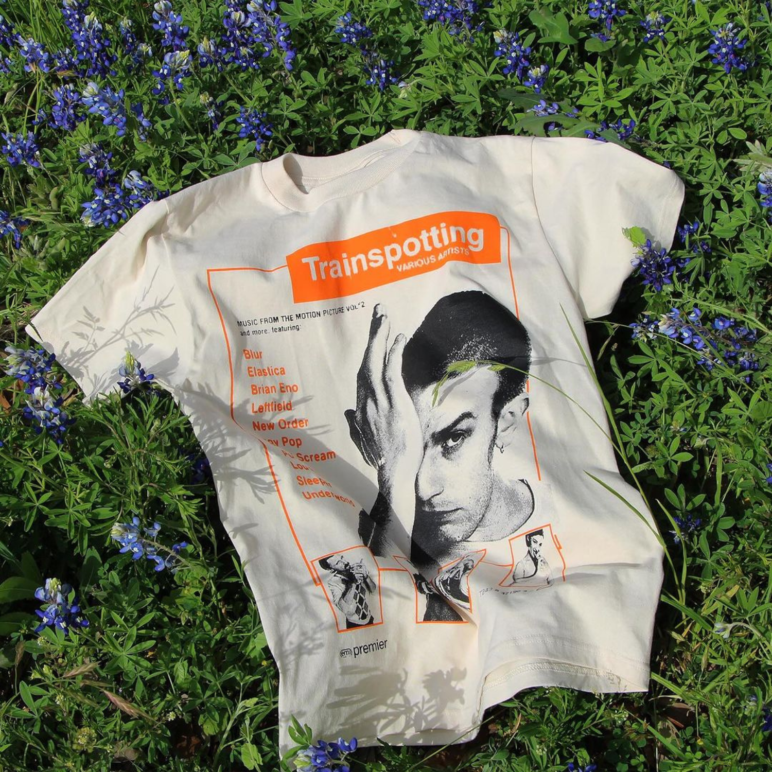 Trainspotting t-shirt with movie poster design on grass with flowers