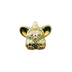 A24 Uncut Gems Gold with blue dots furby enamel pin on a white background