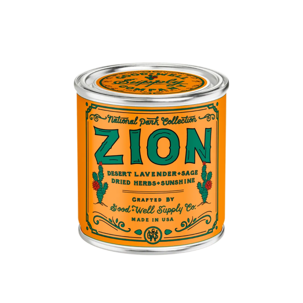 Zion National Park candle in a tin with an orange label on a white background