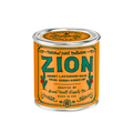 Zion National Park candle in a tin with an orange label on a white background