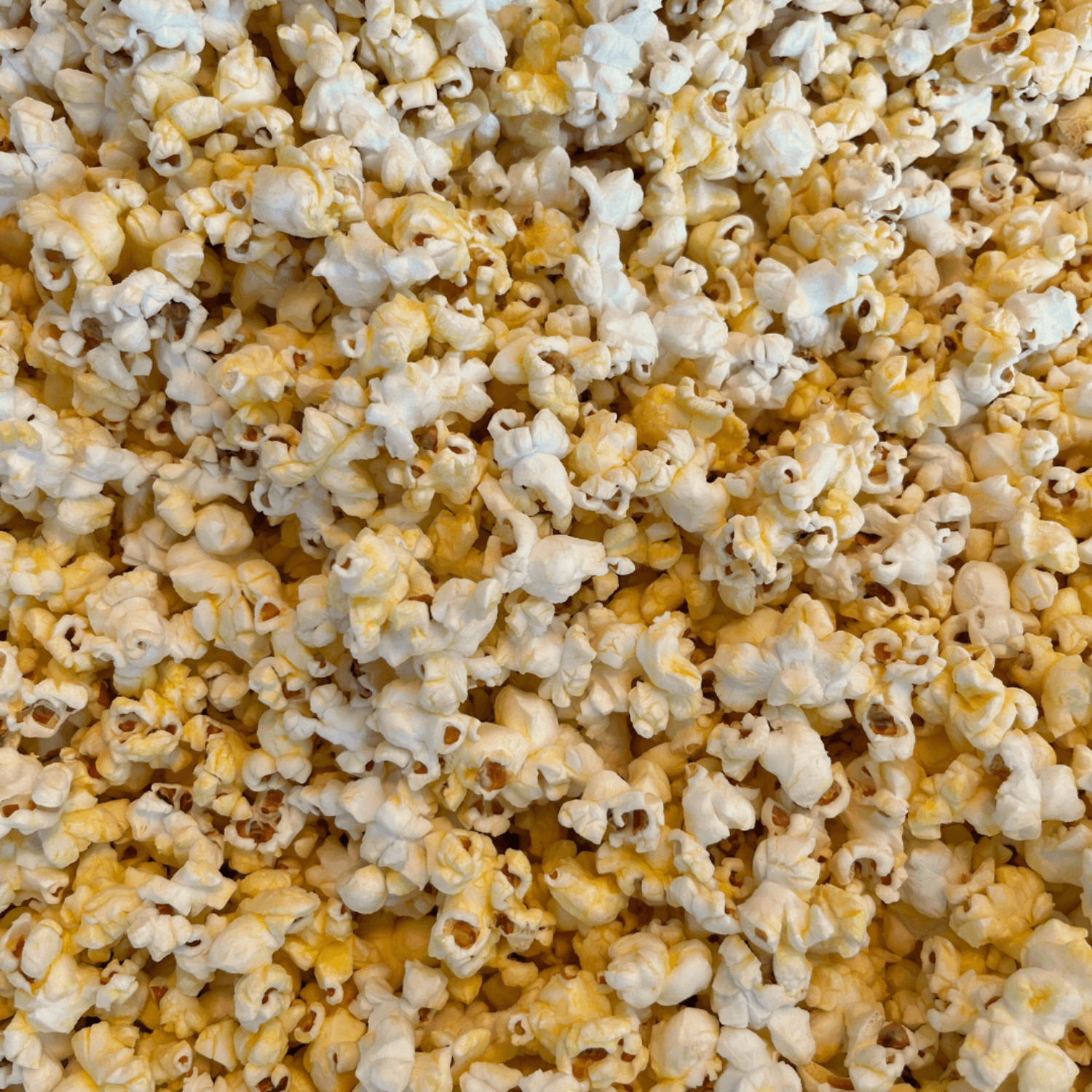 Close-up of buttered popcorn with a focus on texture and color.